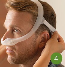 man wearing sleep apnea mask